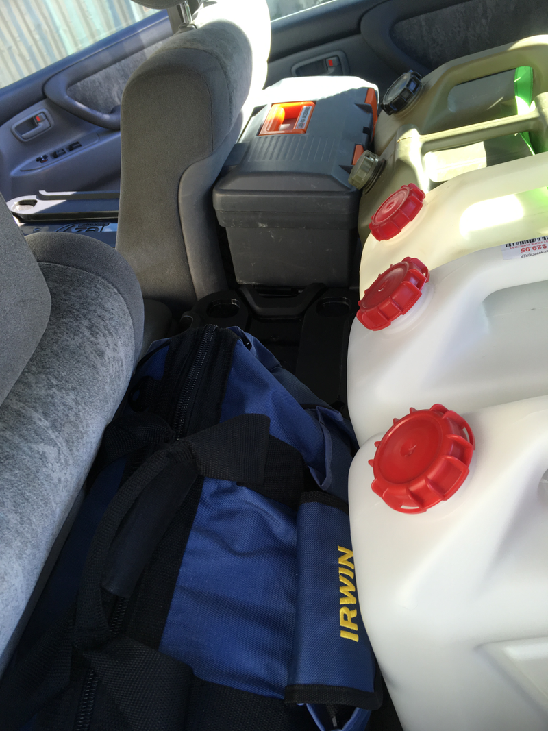 Compressor on top of general tool kit behind drivers eat. Cooking bag on top of dutch over behind passengers seat.